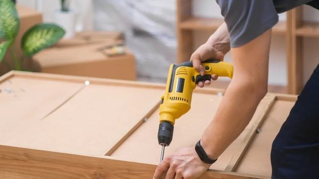 Handyman performing home repairs